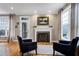 Inviting living room featuring a cozy fireplace and comfortable seating area at 4953 Mashpee Ln, Apex, NC 27539