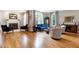 Bright living room boasts hardwood floors, fireplace, and comfortable seating at 4953 Mashpee Ln, Apex, NC 27539