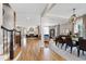 Open-concept living and dining area with hardwood floors and lots of natural light at 4953 Mashpee Ln, Apex, NC 27539