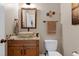 Charming powder room featuring a vessel sink, decorative fixtures, and elegant decor at 4953 Mashpee Ln, Apex, NC 27539