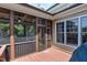 View of screened in back porch with wood floors and ceiling fan at 4953 Mashpee Ln, Apex, NC 27539