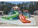 Splash pad features colorful slides, sprinklers, and water features for enjoyment at 4953 Mashpee Ln, Apex, NC 27539