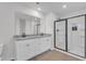 Modern bathroom with a double vanity, granite countertops, and glass-enclosed shower for a luxurious feel at 501 Benton Dr, Oxford, NC 27565