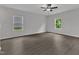 Bright and airy bedroom with sleek floors and plenty of natural light from the two windows at 501 Benton Dr, Oxford, NC 27565