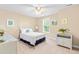 Cozy bedroom with natural light, ceiling fan and white spindle bed frame and side tables at 509 Fish Pond Ct, Rolesville, NC 27571
