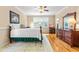 Warm bedroom with natural light, ceiling fan, and wooden floors at 509 Fish Pond Ct, Rolesville, NC 27571