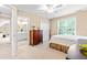 Bedroom with ensuite bathroom and a ceiling fan, filled with natural light from the window at 509 Fish Pond Ct, Rolesville, NC 27571