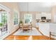 Bright dining area with hardwood floors, light-colored walls, and white trim at 509 Fish Pond Ct, Rolesville, NC 27571