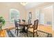 Cozy dining room with a charming table set for four and ample natural light at 509 Fish Pond Ct, Rolesville, NC 27571