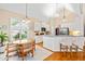 A spacious eat-in kitchen featuring granite countertops, stainless appliances, and ample natural light at 509 Fish Pond Ct, Rolesville, NC 27571