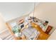 Bright living room features a fireplace, ceiling fan, and open floor plan that flows into the kitchen at 509 Fish Pond Ct, Rolesville, NC 27571