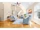 Bright and airy living room with a staircase, fireplace, and hardwood floors at 509 Fish Pond Ct, Rolesville, NC 27571