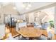 Open-concept living space with hardwood floors, neutral tones, and ample natural light at 509 Fish Pond Ct, Rolesville, NC 27571