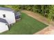 Aerial view of home with flat, manicured backyard that backs up to wooded area at 525 Allesandra Dr, Clayton, NC 27527