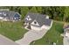 This aerial view showcases a beautiful home with a three-car garage and pristine landscaping at 525 Allesandra Dr, Clayton, NC 27527