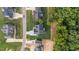 An aerial view of a home showcasing its driveway and landscaping within a residential community at 525 Allesandra Dr, Clayton, NC 27527