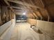 Unfinished attic with wooden supports and exposed insulation at 525 Allesandra Dr, Clayton, NC 27527