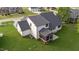 A beautifully landscaped backyard with a screened-in porch and a lush green lawn at 525 Allesandra Dr, Clayton, NC 27527