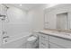 Bathroom with shower/tub combo, toilet, marble floors, and a white vanity with a stone countertop at 525 Allesandra Dr, Clayton, NC 27527
