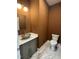 Stylish powder room with modern sink, mirror, and marble-patterned floor at 525 Allesandra Dr, Clayton, NC 27527