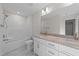 Bright bathroom with a double vanity, granite countertops, and a shower over tub combination at 525 Allesandra Dr, Clayton, NC 27527