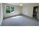 Bedroom boasting natural light, a ceiling fan, double door closet, and neutral carpeting at 525 Allesandra Dr, Clayton, NC 27527