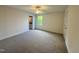 Bedroom with plush carpeting, a ceiling fan, and a window offering natural light at 525 Allesandra Dr, Clayton, NC 27527