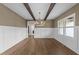 Dining room with wainscoting, wood beams, hardwood floors and natural light at 525 Allesandra Dr, Clayton, NC 27527
