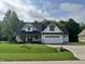 Charming two-story home with a well-manicured lawn and an attached two-car garage at 525 Allesandra Dr, Clayton, NC 27527