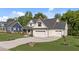 Beautiful home with three-car garage, lush lawn and welcoming facade at 525 Allesandra Dr, Clayton, NC 27527