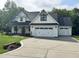 Charming two-story home with a well-manicured lawn and an attached two-car garage at 525 Allesandra Dr, Clayton, NC 27527