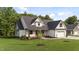 New construction featuring beautiful landscaping, a large yard and inviting entrance at 525 Allesandra Dr, Clayton, NC 27527