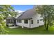 Two-story home with black framed windows, black roof, and a covered porch at 525 Allesandra Dr, Clayton, NC 27527