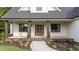 Charming front porch with wood columns and a landscaped walkway at 525 Allesandra Dr, Clayton, NC 27527