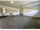 A large, unfinished garage space with concrete floors and white walls, ready for customization at 525 Allesandra Dr, Clayton, NC 27527