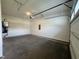 Spacious garage with concrete flooring, white walls, and overhead door hardware installed at 525 Allesandra Dr, Clayton, NC 27527