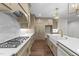 Bright kitchen with a large island, gas cooktop, stainless steel appliances, and hardwood floors at 525 Allesandra Dr, Clayton, NC 27527