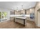 Well-lit kitchen with island, pendant lighting, and new appliances at 525 Allesandra Dr, Clayton, NC 27527