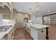 A gourmet kitchen featuring an island, gold pendant lights and stainless steel appliances at 525 Allesandra Dr, Clayton, NC 27527