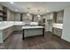 Bright kitchen with island, white countertops, wood floors, and stainless appliances at 525 Allesandra Dr, Clayton, NC 27527