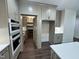 Featuring a large hidden pantry, stainless steel appliances, and lots of cabinet space at 525 Allesandra Dr, Clayton, NC 27527
