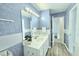 Bathroom featuring textured wallpaper, a shower and a vanity with storage space at 5401 Lower Creek Ct, Apex, NC 27539