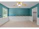 Bedroom featuring neutral carpet, an accent wall, and access to closet/bathroom at 5401 Lower Creek Ct, Apex, NC 27539