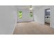 Bright bedroom with two windows, ceiling fan and neutral carpet at 5401 Lower Creek Ct, Apex, NC 27539
