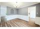 Open dining room with updated flooring, chandelier, and neutral paint colors, ready for entertaining at 5401 Lower Creek Ct, Apex, NC 27539