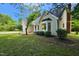 Single-Gathering home with a landscaped front yard and beautiful bay window at 5401 Lower Creek Ct, Apex, NC 27539
