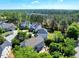 Aerial view showcasing several homes with lush greenery and private patios, offering a serene and private outdoor experience at 5404 Onyx Mill Ct, Raleigh, NC 27616