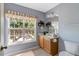 Bright bathroom featuring a vanity with wooden cabinets and a large window providing natural light at 5404 Onyx Mill Ct, Raleigh, NC 27616