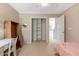 Bedroom with neutral walls, desk, closet, and pink accents at 5404 Onyx Mill Ct, Raleigh, NC 27616