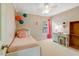 Cozy bedroom featuring a twin bed, desk, and playful decor for a  at 5404 Onyx Mill Ct, Raleigh, NC 27616